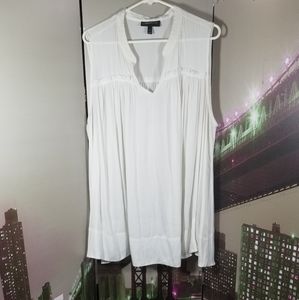 White sheer sleeveless blouse.
